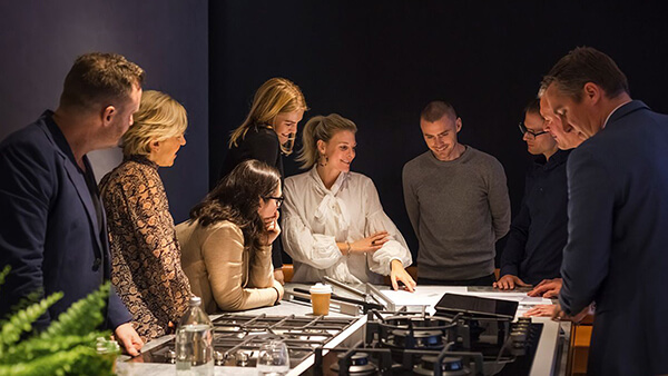 Sales team showcasing flagship products at a Fisher & Paykel Experience Centre.