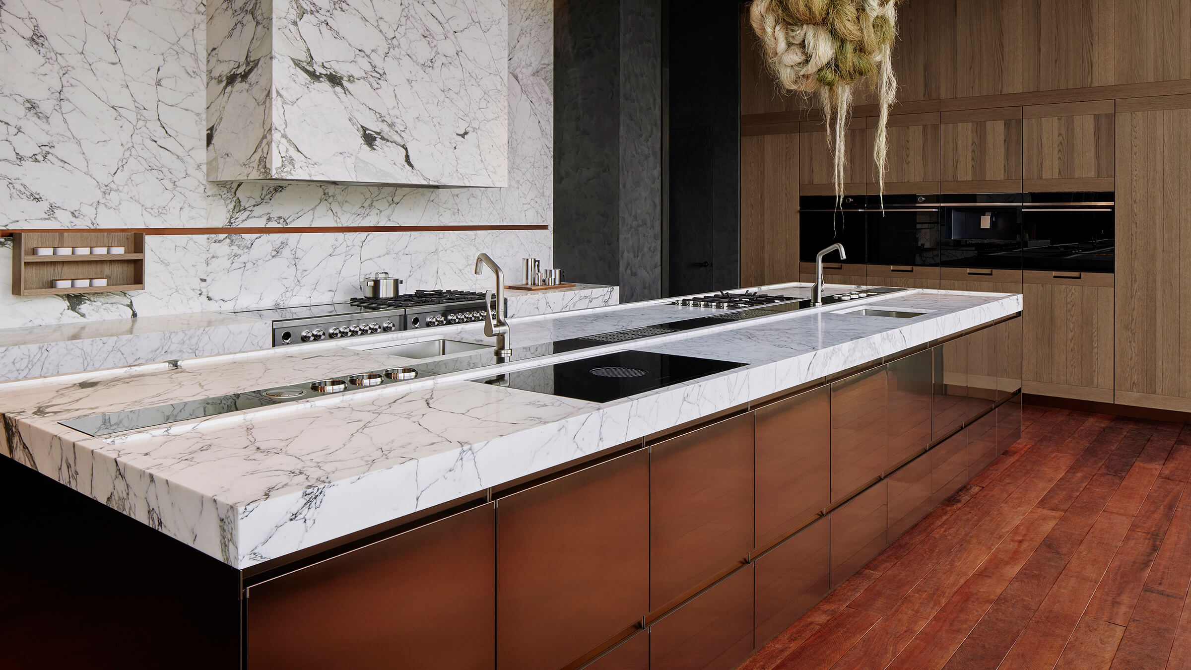 Modern Kitchen with a Black Glass Induction Cooktop and an Integrated Range Hood.